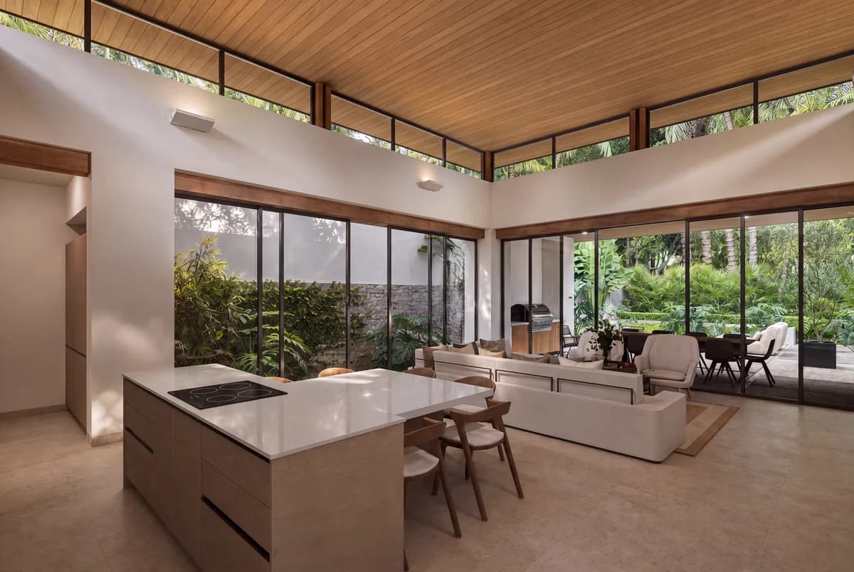 Architectural visualization of a Model C kitchen, living room and garden connection at Sueños del Mar.
